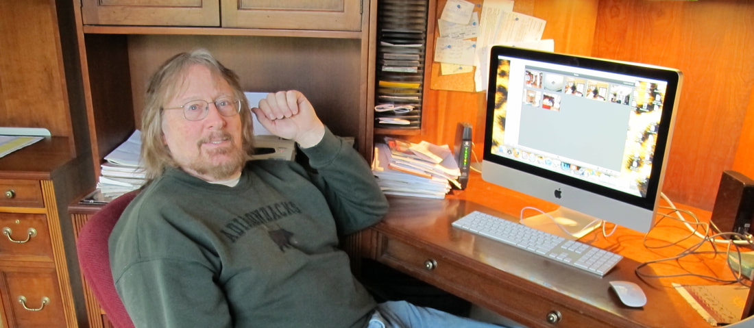 Brian J Heinz at his desk, author of 'Peabody Pond', a teen thriller novel [4RV Publishing]